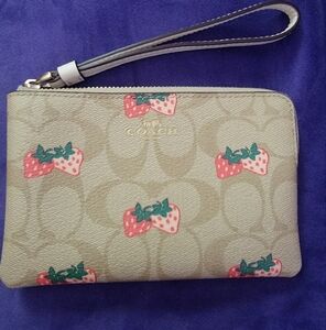 Coach Beige Wristlet with Strawberry Design